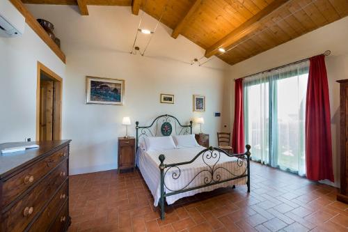 Кровать или кровати в номере Agriturismo Podere l'Aione