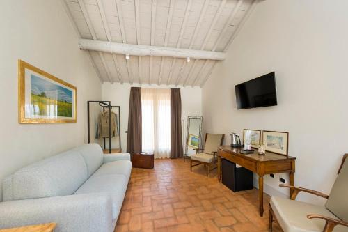 Телевизор и/или развлекательный центр в Agriturismo Podere l'Aione
