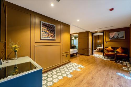 a living room with a couch and a room at Son Hoi An Boutique Hotel & Spa in Hoi An