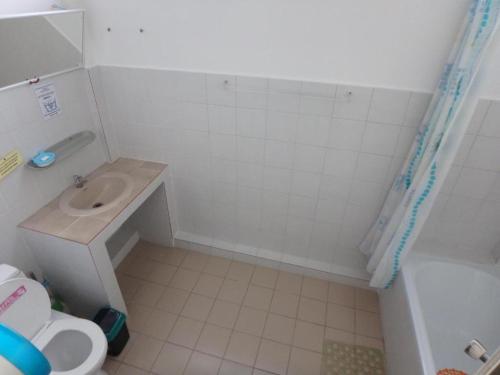 a bathroom with a sink and a toilet at Wayside Guesthouse in Chiang Mai