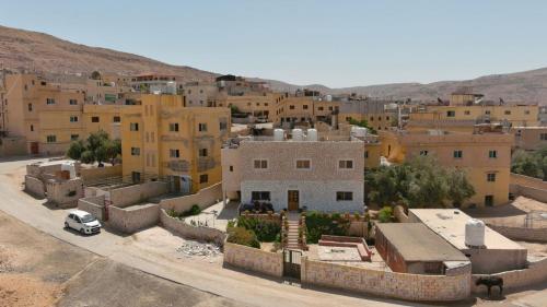 an aerial view of a city with buildings at Happy Bedouin House Petra in Al Ḩayy
