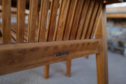 a wooden bench with a sign that says control on it at Blue Calm Luxury Villa in Sifnos in Artemonas