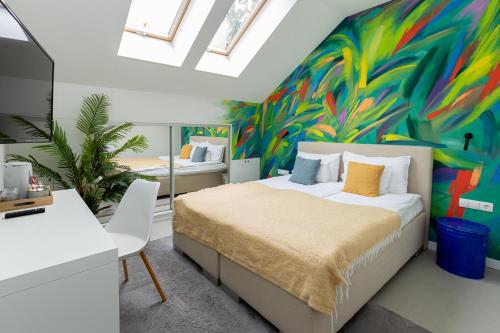 Postel nebo postele na pokoji v ubytování Butik Art Hotel
