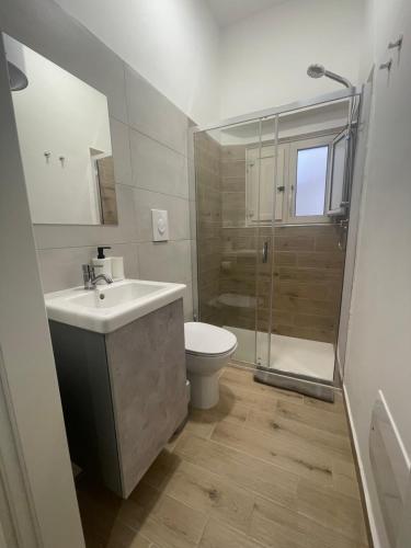 a bathroom with a sink and a toilet and a shower at GM IMMOBILIARE in Reggio di Calabria