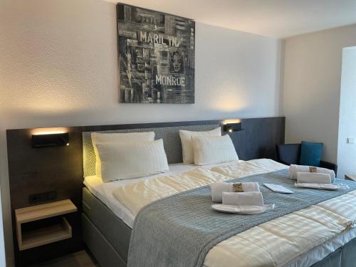 Postel nebo postele na pokoji v ubytování Hotel Corsten