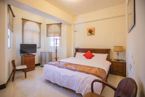 Postel nebo postele na pokoji v ubytování Shang Her Yuan B&B