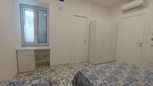 Ένα ή περισσότερα κρεβάτια σε δωμάτιο στο B & Beach
