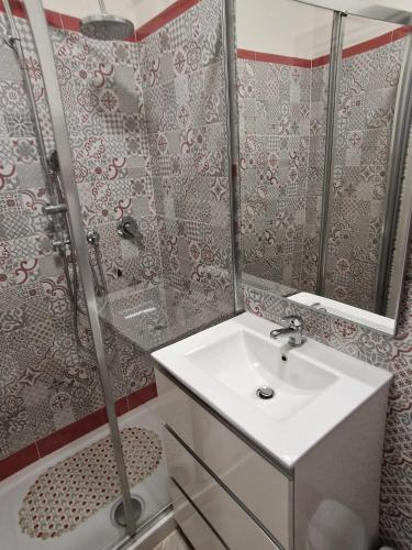 a bathroom with a sink and a shower at Pigneto Square Home in Rome