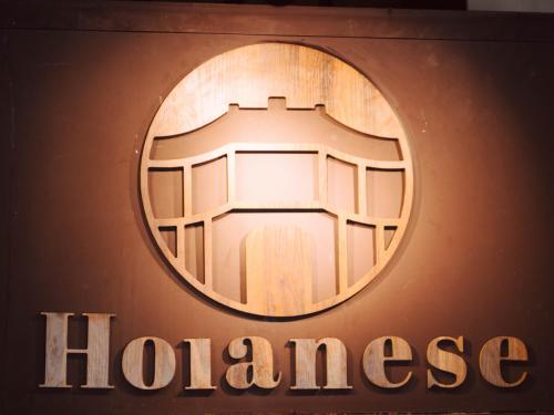 a sign for a hanghaiurance store at Hoianese Center Hotel - Truly Hoi An in Hoi An
