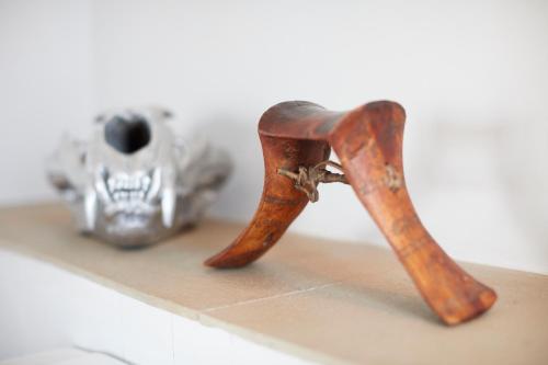 a pair of boots sitting on a counter next to a skull at Loisaba Lodo Springs in Tura