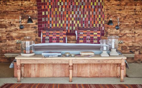 a room with a bed and a table with a table sidx sidx sidx at Loisaba Lodo Springs in Tura