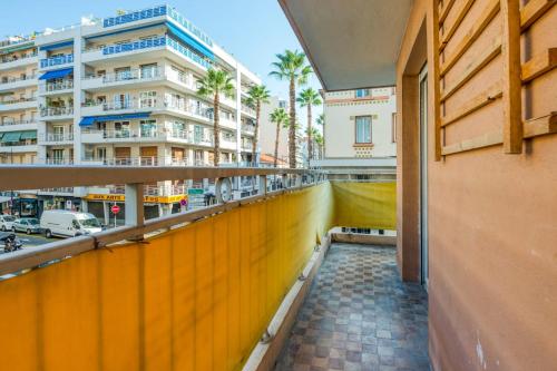 a balcony with a view of a city at Appartement Wilsonia - Welkeys in Antibes