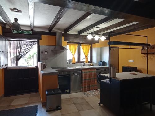 a kitchen with a sink and a stove at Inma Enea in Armañanzas