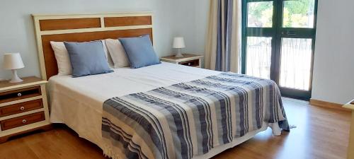 Postel nebo postele na pokoji v ubytování Casa da Travessa - casa de férias no coração de Faro