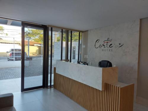a lobby of a hotel with a reception desk at HOTEL CORTESE in Teresina