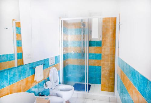 a bathroom with a toilet and a shower at Emerald's Resort - Rachele in Conca dei Marini