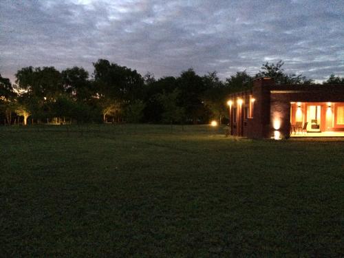 a small house in a field at night at Casonas de Nono in Nono