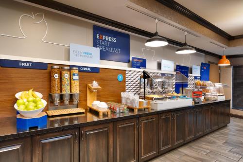 a food counter in a store with fruits and vegetables at Holiday Inn Express Hotel & Suites Billings by IHG in Billings