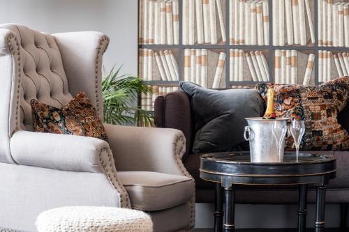 a living room with a chair and a coffee table at The Gannet Inn in St Ives