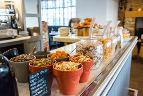 a buffet line with different types of food in containers at The Gannet Inn in St Ives
