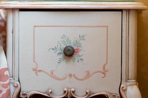 a box with a painting of a bug on it at Hotel Santa Marina in Venice