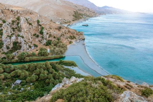 an aerial view of a beach next to the ocean at Minos Beach Art Hotel, a Member of Design Hotels in Agios Nikolaos