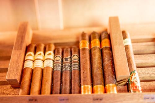 a wooden box filled with different types of cigars at Boutique Hotel Pellas in Vella