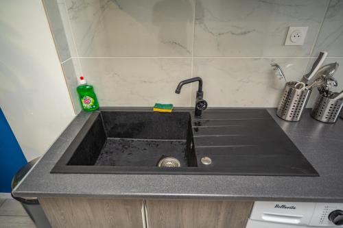 Η κουζίνα ή μικρή κουζίνα στο Capsule océan - Jacuzzi - Billard - Netflix - 2 Chambres - Cuisine