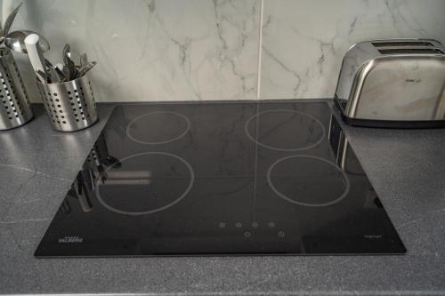 Η κουζίνα ή μικρή κουζίνα στο Capsule océan - Jacuzzi - Billard - Netflix - 2 Chambres - Cuisine