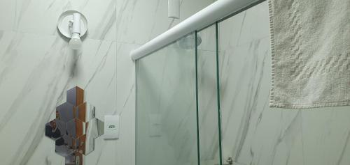 a shower with a glass door in a bathroom at Apartamento Figueiredo Magalhães in Rio de Janeiro