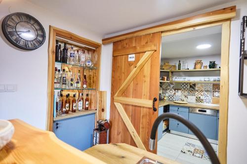 a kitchen with a wooden door and a counter at Zagorska Bajka in Krapina