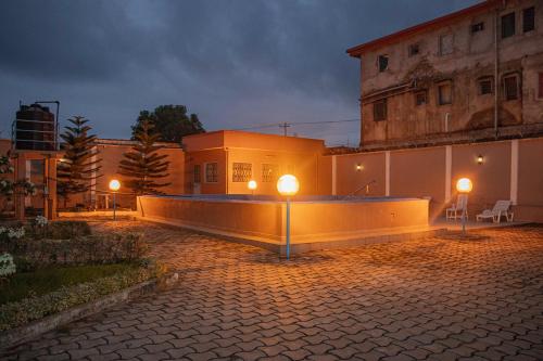 a building with two lights on the side of it at ORION RESIDENCY BONABERIE in Douala