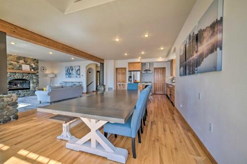 a dining room and living room with a table and chairs at Spacious Lake Stevens Home with Fire Pit, Patio in Lake Stevens