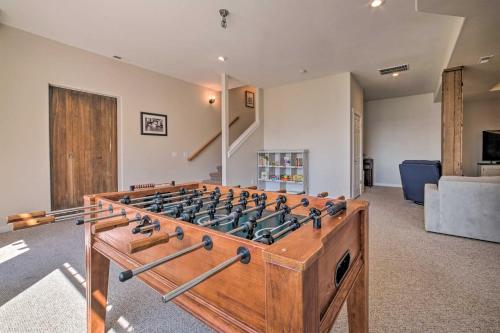 a wooden foosball table in a living room at Spacious Lake Stevens Home with Fire Pit, Patio in Lake Stevens
