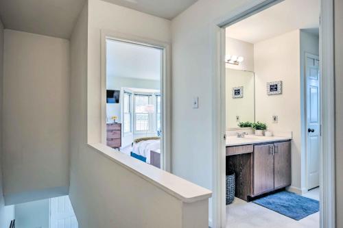 a bathroom with a sink and a mirror at Historic Dtwn Home 2 Mi to Military Park! in Gettysburg