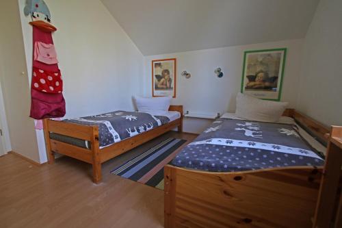 a bedroom with two twin beds in it at Seeadler 3 - Süssau in Süssau