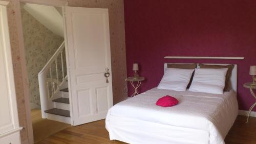 Ένα ή περισσότερα κρεβάτια σε δωμάτιο στο La Maison des Renaudières