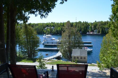a boat is docked at a marina on a lake at Big Tub Resort & Marina in Tobermory