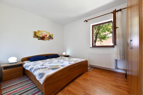 Postel nebo postele na pokoji v ubytování Holiday Home Matan
