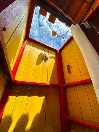 a view from the inside of a boat with a window at Pousada Velho Bateau in Atins