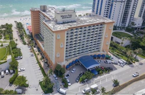 an aerial view of a hotel on the beach at Ramada Marco Polo Beach in Miami Beach