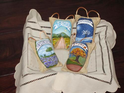 a white bag with three pairs of socks on it at Casa Rural La Calderina in Urda