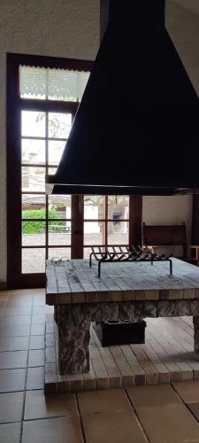 a stone bench in a room with a large window at Casa Rural Eucaliptus in Montferri