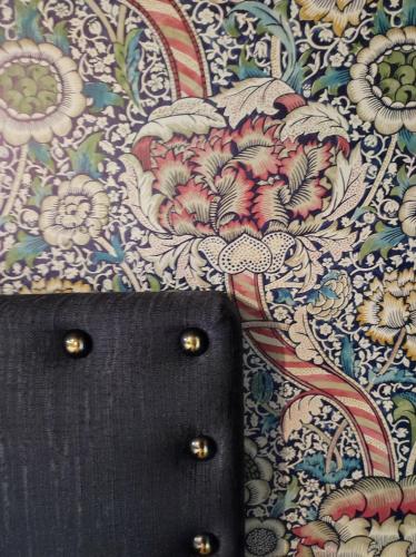 a close up of a purse on a cloth with flowers at Casetta Morris in Valdobbiadene
