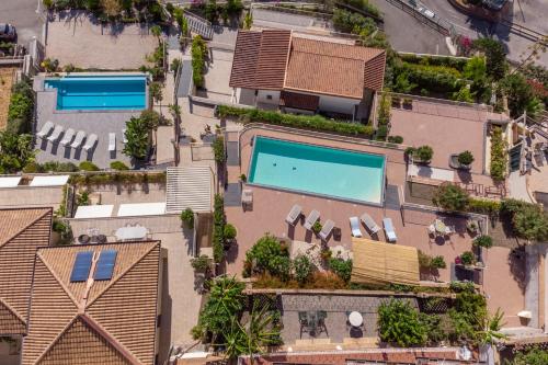 an overhead view of a building with two swimming pools at Taormina Skyline in Taormina