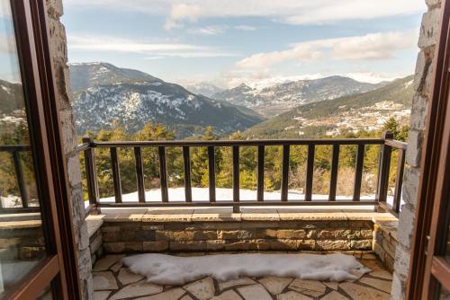 a balcony with a view of the mountains at Karyatis Resort in Synikia Mesi Trikalon