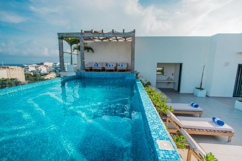 a swimming pool on top of a building at Condos with ocean view pool in Av 10 & 60 street in Playa del Carmen