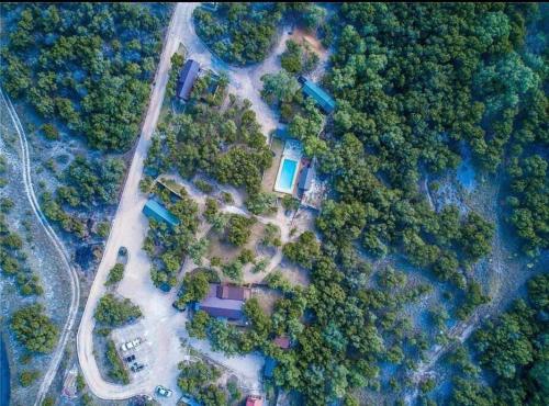 an aerial view of a house in the forest at The Coyote Cabin - Cabins at Rim Rock in Austin