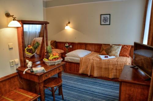 Postel nebo postele na pokoji v ubytování Spa & Wellness Hotel Harmonie