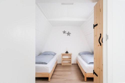 Postel nebo postele na pokoji v ubytování Vakantiewoning 't Juttershuis Egmond aan Zee
